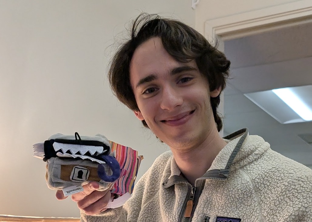 serteal in Berkeley, holding a small fuzzy mimic plush filled with polyhedral dice